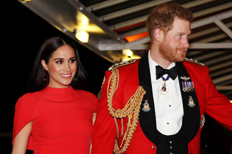 Meghan Markle Stuns in Red Caped Dress From Safiyaa